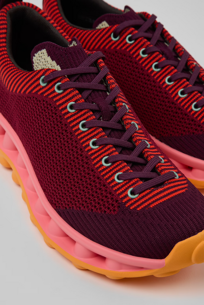 Close-up of Camper x SUNNEI PELOTISSIMA sneakers in burgundy, pink and orange with lace-up detail