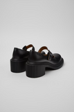 Rear view of black Camper Pix London leather heels with chunky ribbed outsole.