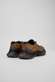 Rear view of Karst 2 sneakers by Camper showing black heel details and Vibram branding.