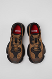 Top view of brown and black Camper Karst 2 sneakers with red OrthoLite® footbeds.