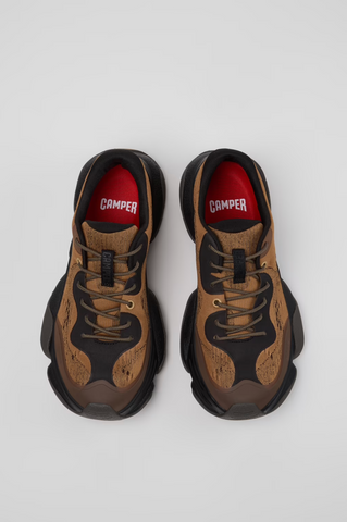 Top view of brown and black Camper Karst 2 sneakers with red OrthoLite® footbeds.