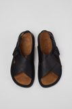 op view of black Camper Lluc sandals with crossed straps and open toe design.