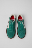 Top view of green Camper Pelotas Soller sneakers with matching laces and red footbeds.