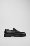 Side view of a black Camper Twins leather moccasin with brogue detailing and a lightweight XL EXTRALIGHT® EVA outsole.