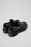 Rear angled view of black Camper Twins leather moccasins showing the heel, brogue detailing and layered black sole.