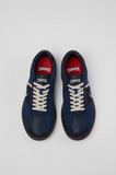 Top view of blue Camper Pelotas Soller sneakers with cream laces, red insoles and Camper branding.