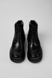 Top view of Camper Alaro men's black leather ankle boots showing the rounded toe shape and upper design