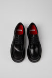 Top view of Camper Alaro men's black leather shoes showing the rounded toes and upper design