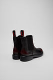 Rear view of Camper Dean men's black and burgundy leather ankle boots showing the heel and back construction