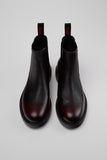 Top view of Camper Dean black and burgundy leather ankle boots showing the opening and upper shape