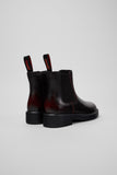 Rear view of Camper Dean black and burgundy leather ankle boots showing the heel and back construction