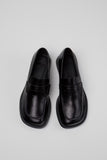 Top view of Camper Donna black leather loafers with classic penny loafer straps