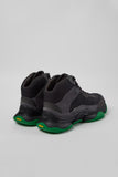 Rear three-quarter view of Camper Karst 2 black textile and nubuck sneakers showing the heel construction and sculptural sole