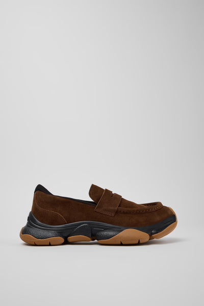 Side view of Camper Karst 2 brown suede moccasins showing the sculptural black and tan rubber sole