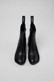 Top view of Camper Kora black leather ankle boots showing the rounded toe and upper shape