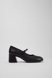 Side view of Camper Kora black leather Mary Jane shoes showing the sculptural block heel and buckle strap