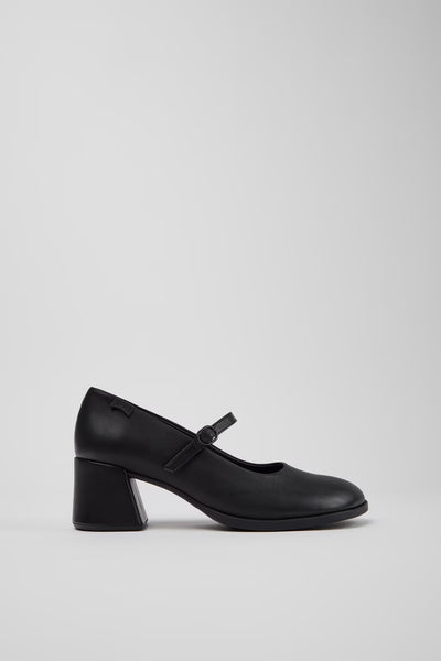 Side view of Camper Kora black leather Mary Jane shoes showing the sculptural block heel and buckle strap