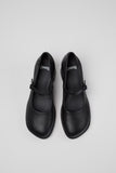 Top view of Camper Kora black leather Mary Jane shoes showing the straps and rounded toes