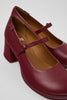 Close-up of Camper Kora burgundy leather shoes showing rounded toe and buckle strap