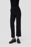 Camper Milah black leather moccasins worn on foot, showing their shape and proportions