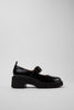 Side view of Camper Milah black leather shoes showing their chunky silhouette and substantial sole