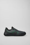 Side view of Camper Peu Serra men's grey textile sneakers showing the rounded silhouette and rugged rubber sole