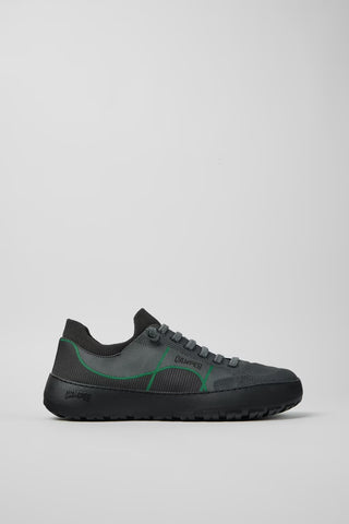 Side view of Camper Peu Serra men's grey textile sneakers showing the rounded silhouette and rugged rubber sole