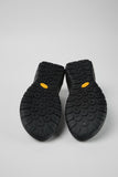 Underside of Camper Peu Serra grey sneakers showing the Vibram Ecostep rubber outsole and tread pattern