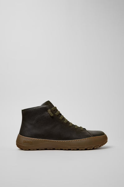 Side view of Camper Peu Serra men's green leather ankle boots showing the rugged Vibram rubber sole and rounded silhouette