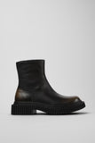 Side view of Camper Pix Berlin men's black and brown leather ankle boots showing the sculptural sole and ankle-high silhouette