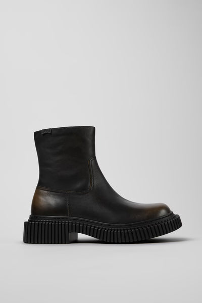 Side view of Camper Pix Berlin men's black and brown leather ankle boots showing the sculptural sole and ankle-high silhouette