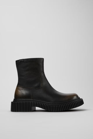 Side view of Camper Pix Berlin men's black and brown leather ankle boots showing the sculptural sole and ankle-high silhouette