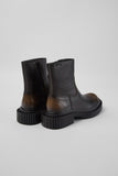 Rear three-quarter view of Camper Pix Berlin black leather ankle boots showing the heel and ankle shaft