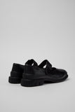 Rear three-quarter view of Camper Pix black leather ballerinas showing the heel and sole profile