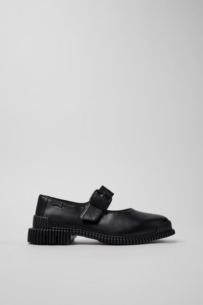 Side view of Camper Pix black leather ballerinas showing the Mary Jane strap and substantial sole