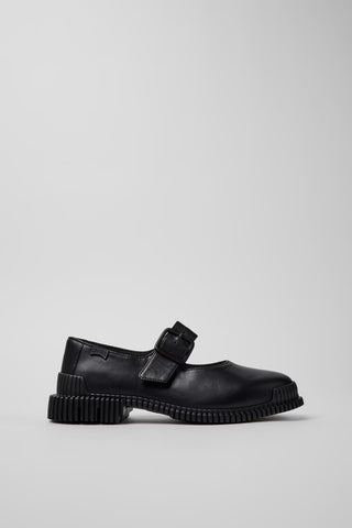 Side view of Camper Pix black leather ballerinas showing the Mary Jane strap and substantial sole