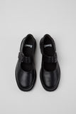 Top view of Camper Pix black leather ballerinas showing the straps and rounded toe shape