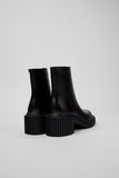 Rear view of Camper Pix London black leather ankle boots showing the shaped heel and ankle shaft