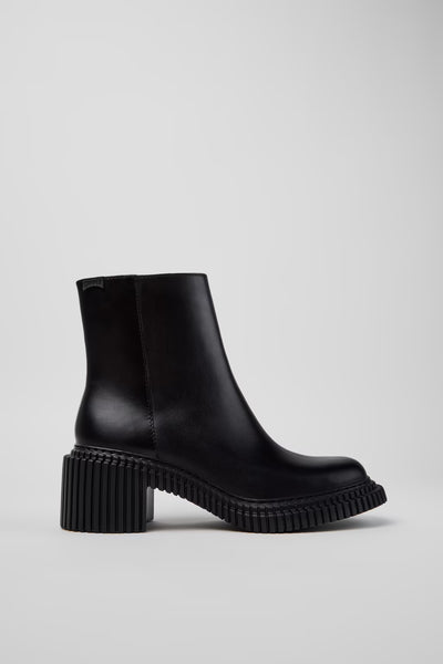 Side view of Camper Pix London black leather ankle boots showing the sculptural heel and sleek ankle silhouette