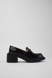 Side view of Camper Pix London black leather heeled loafers showing the sculptural heel and penny-loafer design
