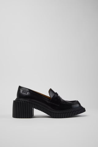 Side view of Camper Pix London black leather heeled loafers showing the sculptural heel and penny-loafer design