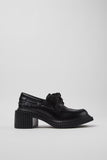 Side view of Camper Pix London black leather heeled loafers showing the sculptural sole and raised heel