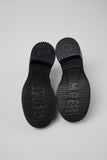 Underside of Camper Pix London black leather heeled loafers showing the outsole design