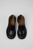 Top view of Camper Pix London black leather heeled loafers showing the penny straps and toe shape