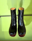 Front view of Chie Mihara TALENA black croc-embossed leather ankle boots