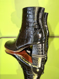 Heel detail of Chie Mihara TALENA black croc-embossed leather ankle boots