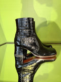 Side view of Chie Mihara TALENA black croc-embossed leather ankle boots