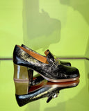 Side view of Chie Mihara TEIL black and ocher leather shoes