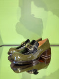 Angled view of Chie Mihara XYZEN green and brown leather shoes