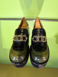 Front view of Chie Mihara XYZEN green and brown leather shoes